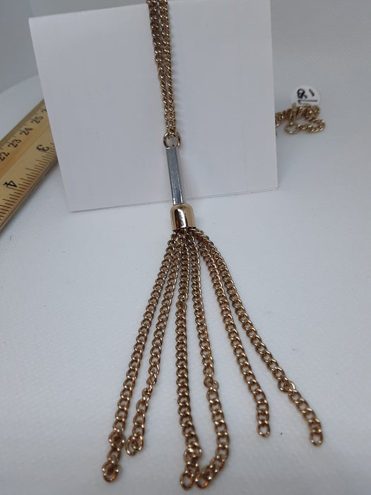 Goldtone necklace with a flowing chain pendant