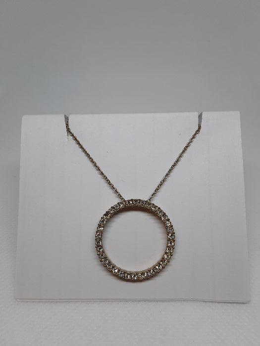 Goldtone necklace with rhinestone circle pendant