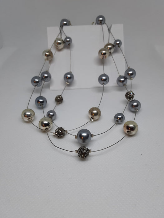 Silvertone necklace with gold, silver, and rhinestone balls