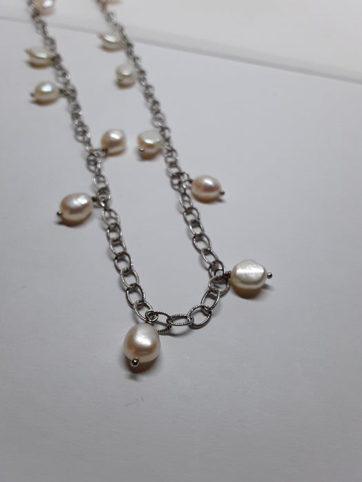Silvertone necklace with white beads and earrings