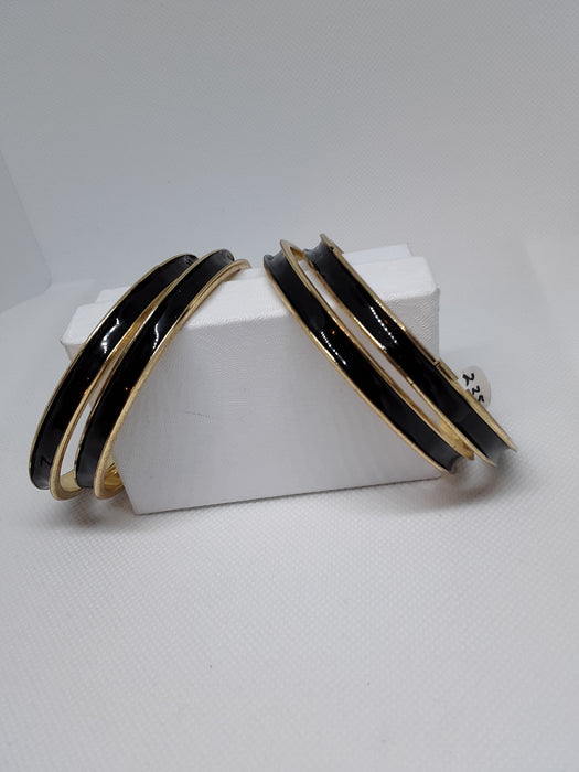 Goldtone bracelets with black enamel finish