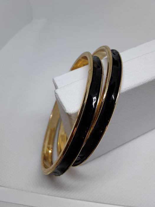 Goldtone bracelets with black enamel finish