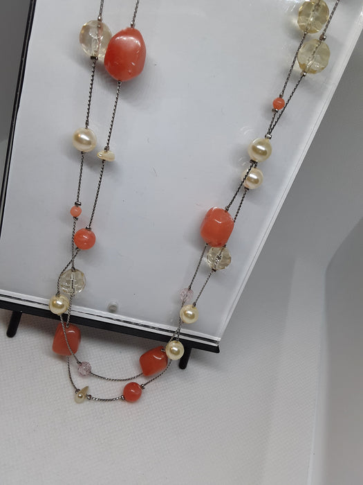 Silvertone necklace with melon colored beads