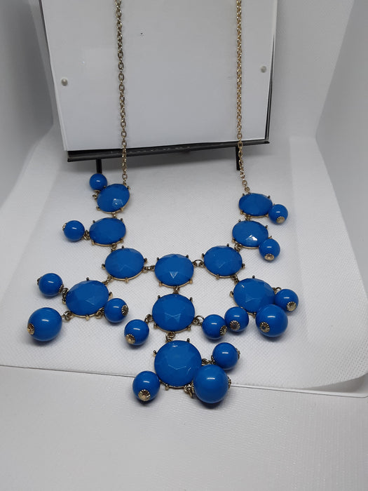 Goldtone chandelier necklace with blue beads