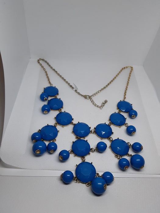 Goldtone chandelier necklace with blue beads