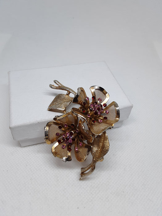 Vintage brasstone floral brooch with rhinestones