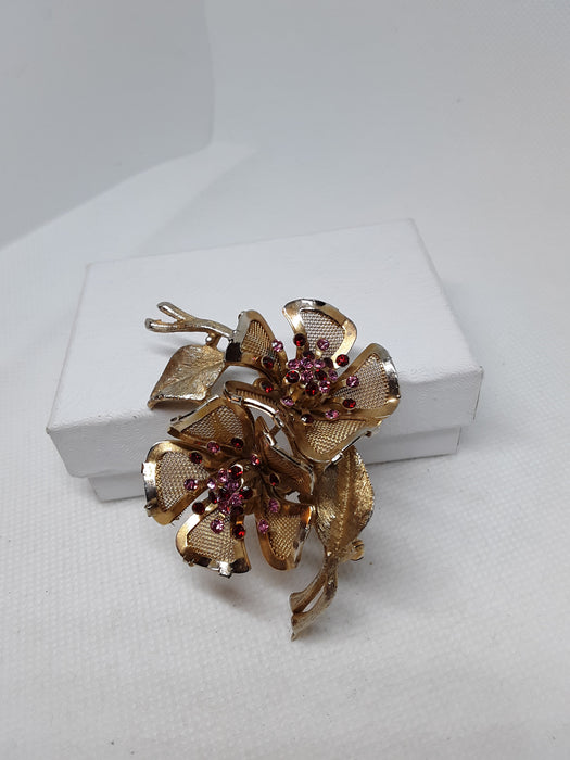 Vintage brasstone floral brooch with rhinestones