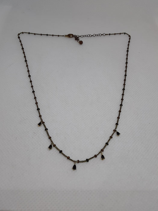 Brasstone necklace with black teardrop beads