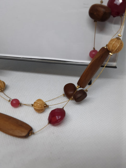 Cord necklace with brown and pink beads