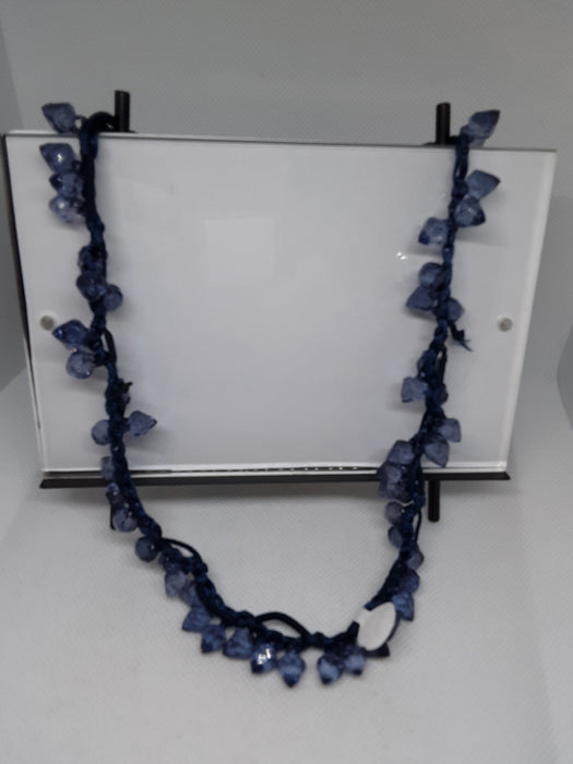 Blue corded necklace with blue beads