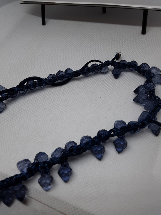 Blue corded necklace with blue beads