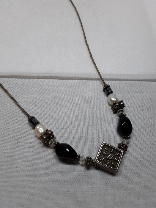 Silvertone necklace with black and white beads
