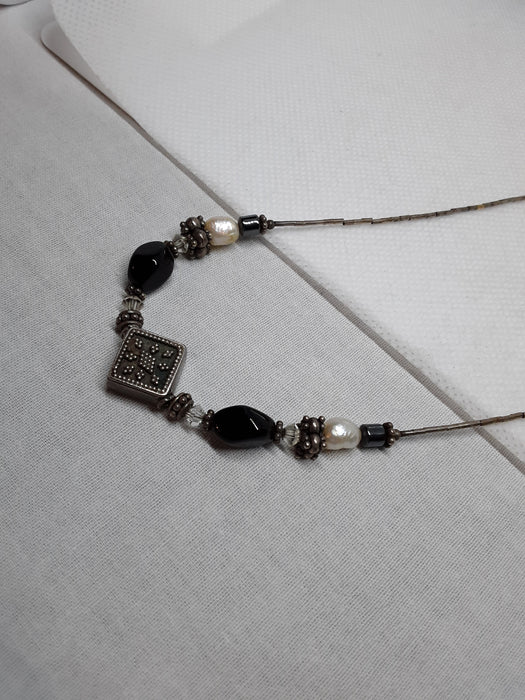 Silvertone necklace with black and white beads