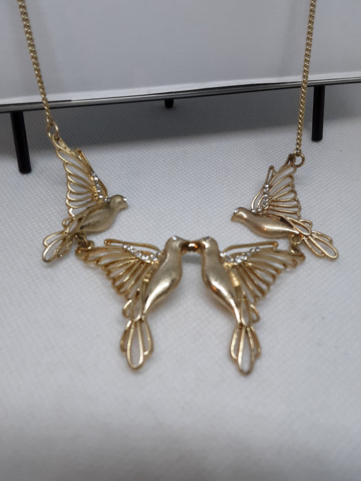 Goldtone bird necklace with rhinestone accents