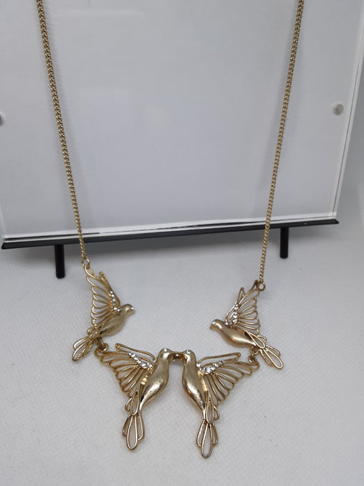 Goldtone bird necklace with rhinestone accents